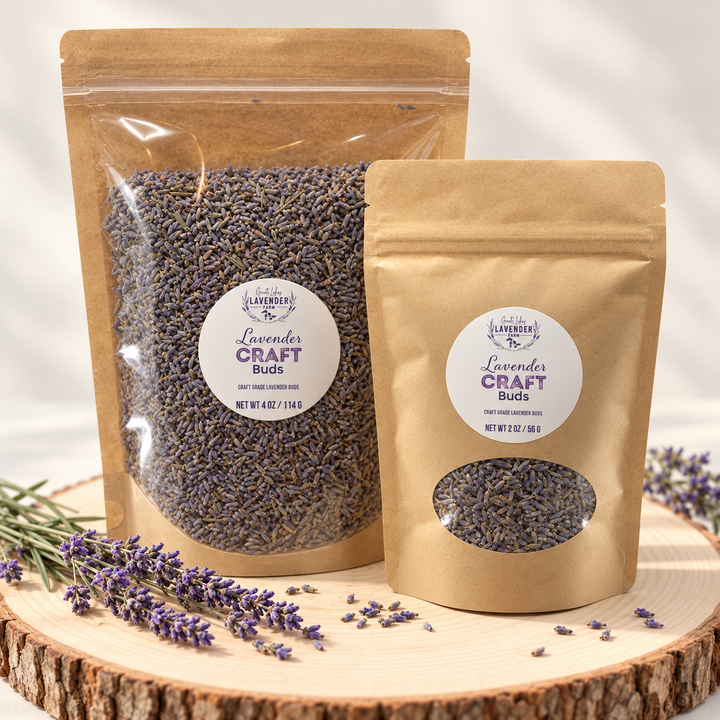 Craft Lavender Buds in 4 oz and 2 oz kraft pouches with windows on a wood slice with lavender