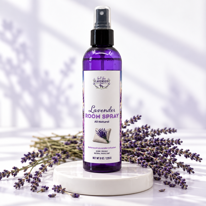 Lavender Room Spray 8 oz purple bottle on a white round with dried lavender bundles