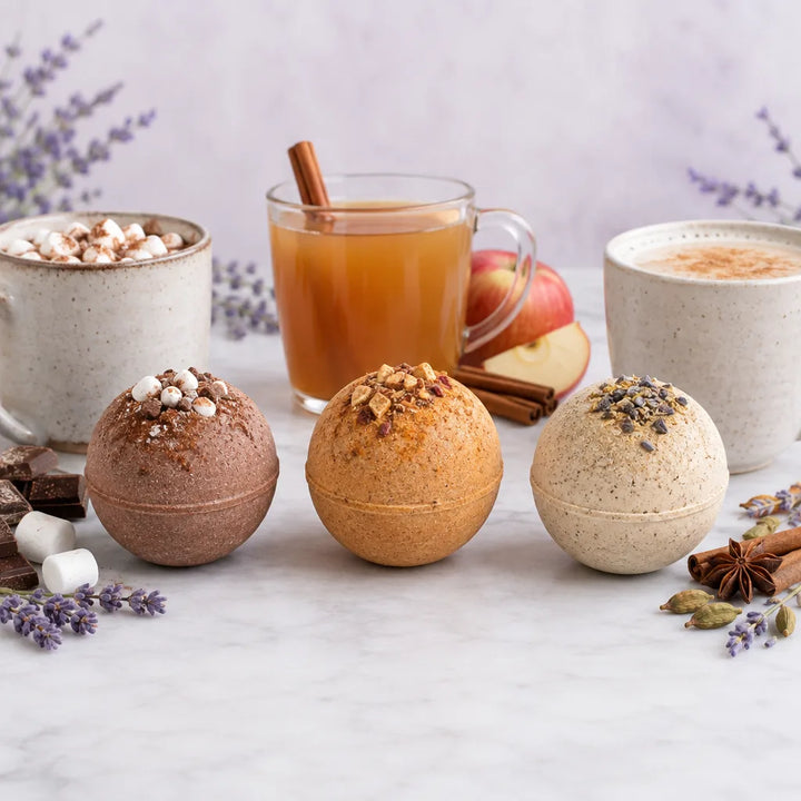 Lavender Drink Bombs, three spheres for cocoa, apple cider and chai lattes, with mugs of each drink