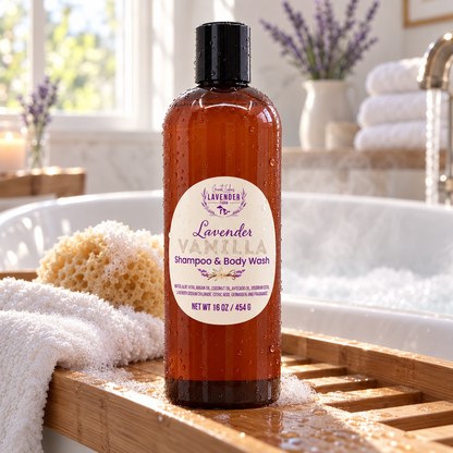 Lavender Vanilla Shampoo & Body Wash bottle with drops of water near bath, with lavender and towels nearby.