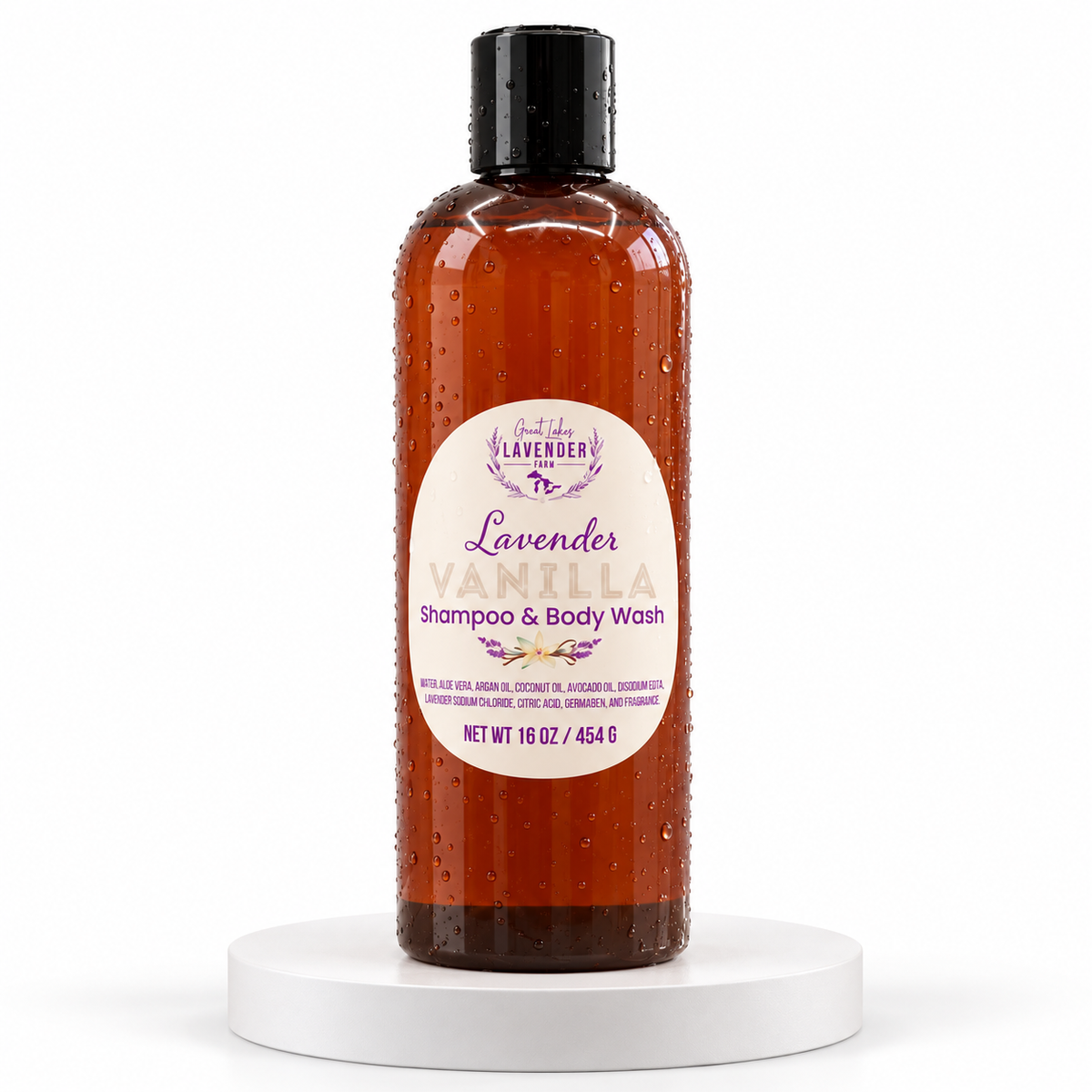 Lavender Vanilla Shampoo & Body Wash in amber 16 oz bottle with black cap on white pedestal.