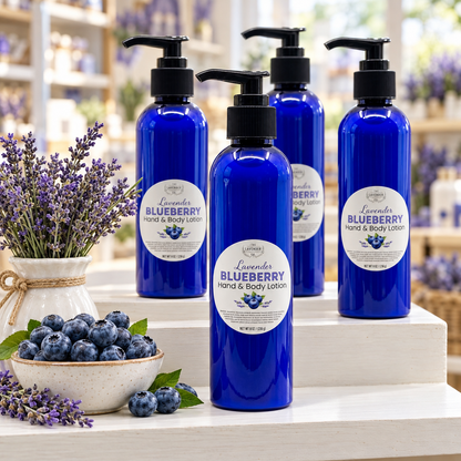 Four bottles of Lavender Blueberry Hand & Body Lotion on a tiered shop display with blueberries and lavender