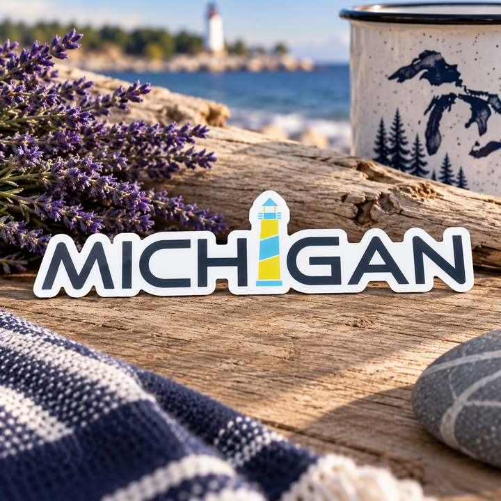 Michigan Lighthouse Lavender Sticker, MICHIGAN wordmark with a lighthouse I, on driftwood with lavender