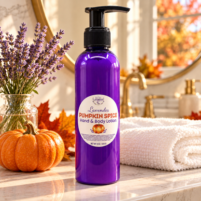 Lavender Pumpkin Spice Hand & Body Lotion on a bathroom counter with a pumpkin, lavender in a vase and a towel