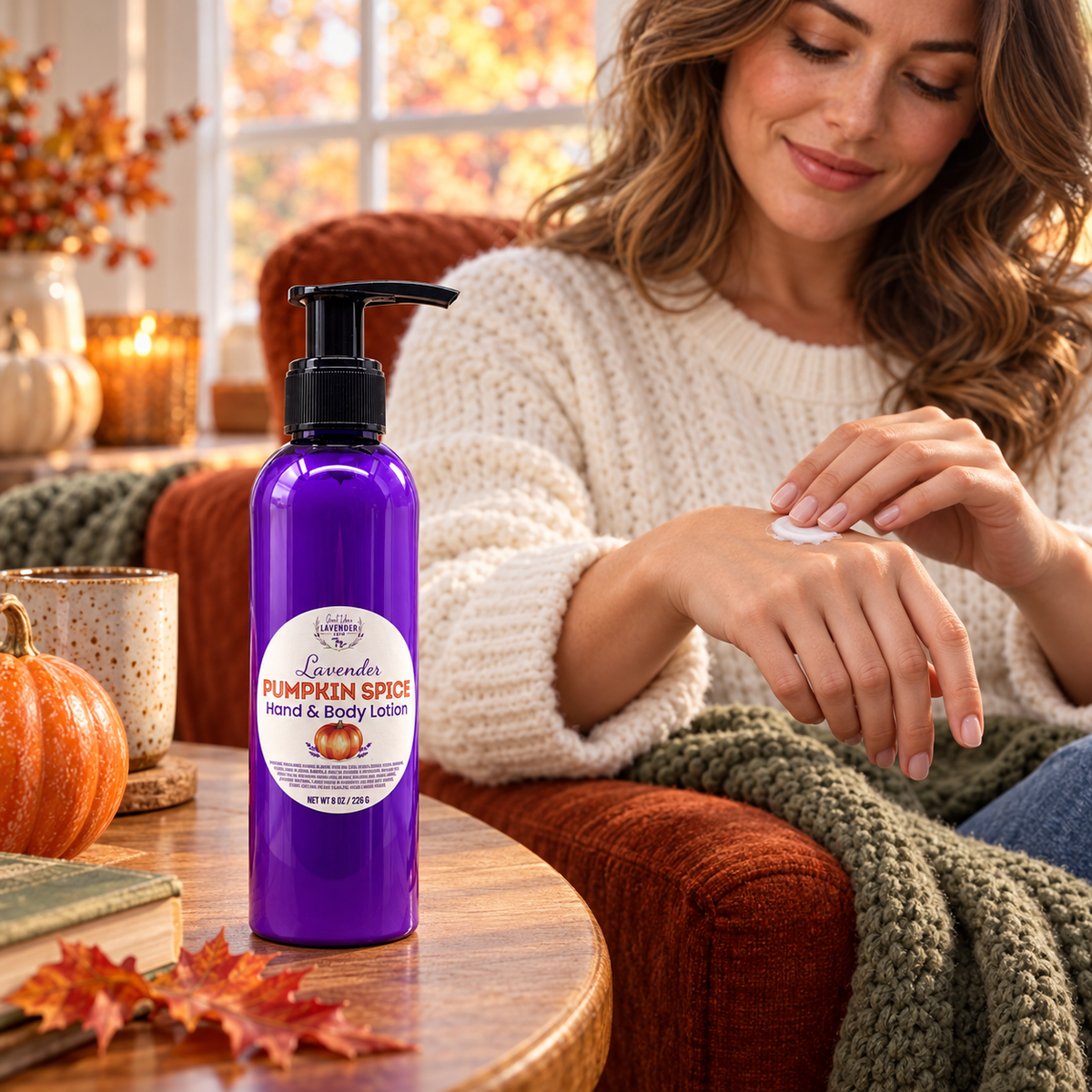Lavender Pumpkin Spice Hand & Body Lotion on a side table as a woman in a sweater rubs lotion into her hand