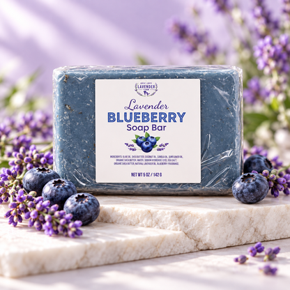 Lavender Blueberry Soap Bar, blue bar in clear wrap on marble with fresh blueberries and lavender sprigs