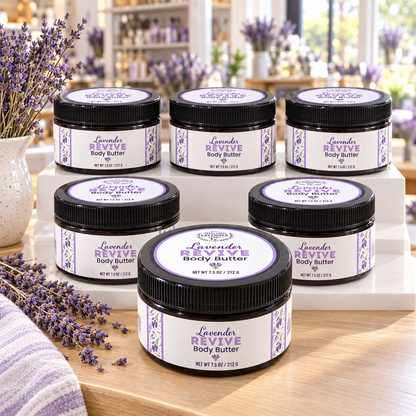 Lavender Revive Body Butter jars arranged on a tiered white display with lavender in a shop