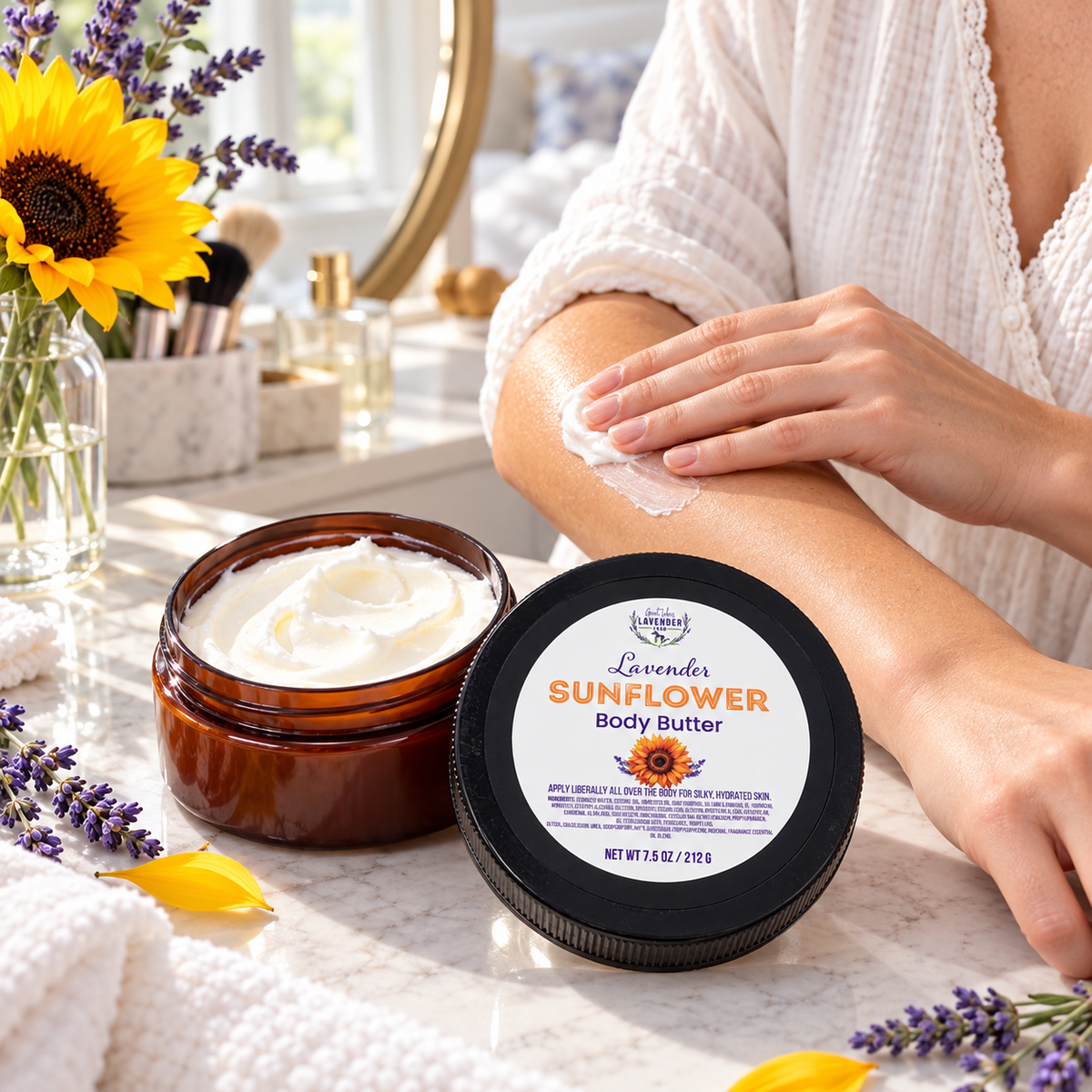 Lavender Sunflower Body Butter open jar on a vanity as a woman smooths the cream onto her arm