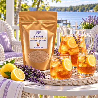 Lavender Half & Half Lemonade & Iced Tea Mix pouch with iced tea glasses and a pitcher on a lakeside porch