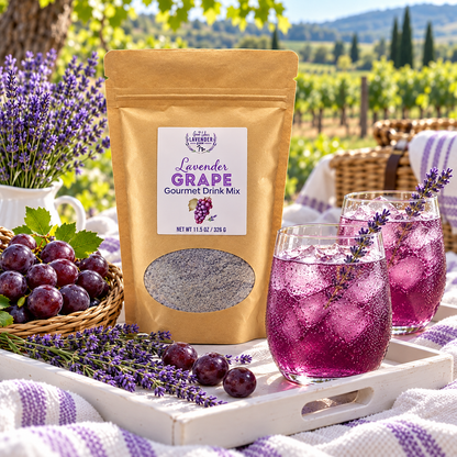 Lavender Grape Gourmet Drink Mix pouch on a tray with two glasses of grape drink near a vineyard