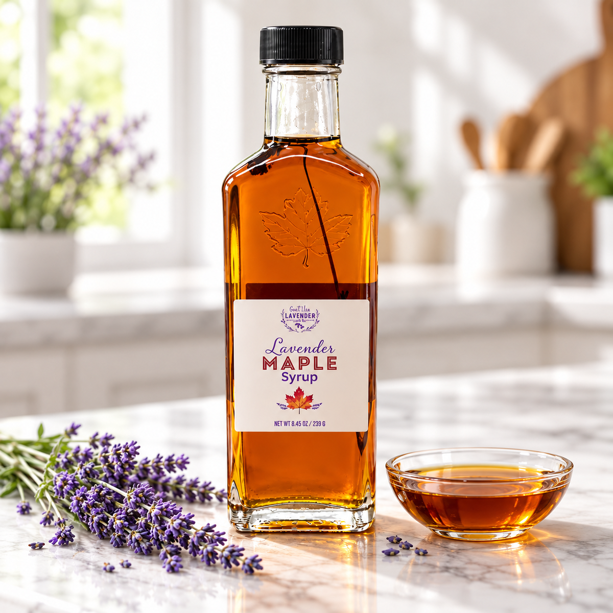 Lavender Maple Syrup bottle on a marble counter beside a small glass bowl of syrup and lavender sprigs
