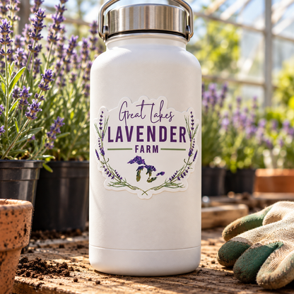 Great Lakes Lavender Farm Logo Vinyl Waterproof Sticker on a white water bottle beside potted lavender