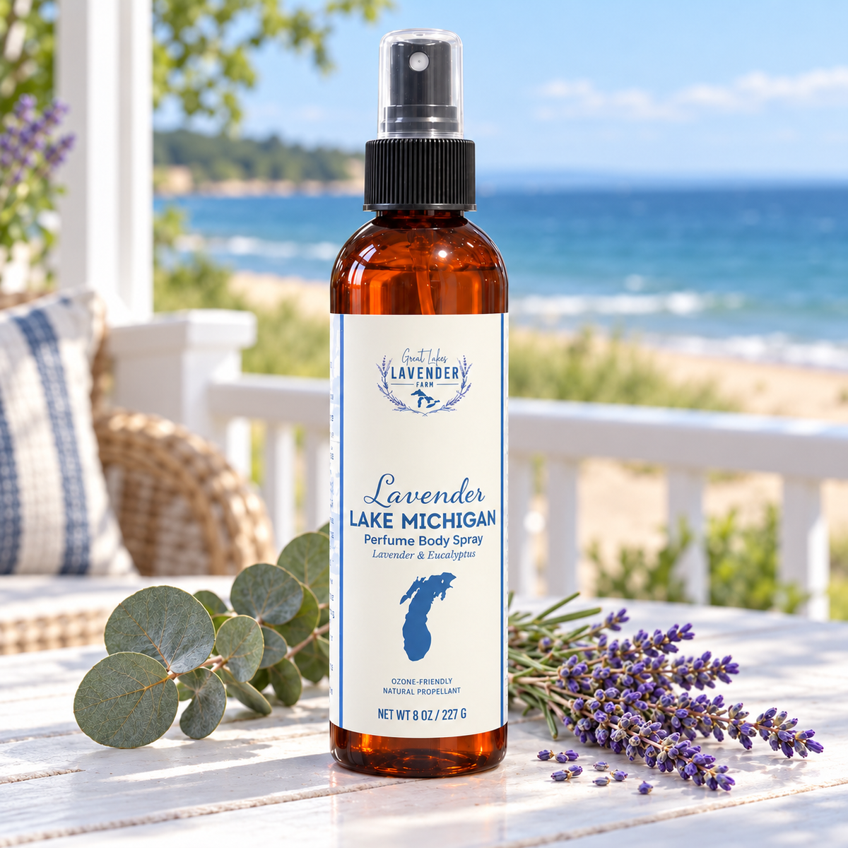 Lavender Lake Michigan Perfume Body Spray on a porch table with eucalyptus and a lake view