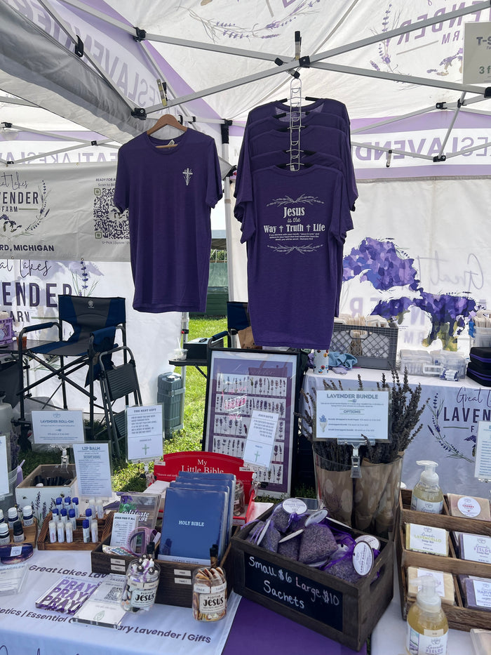 Market table with sachets, soaps, Bibles and faith shirts