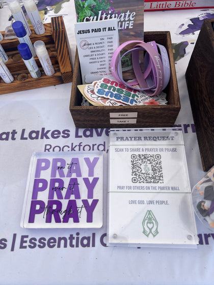 Pray on it sign and a prayer request QR code on the market table