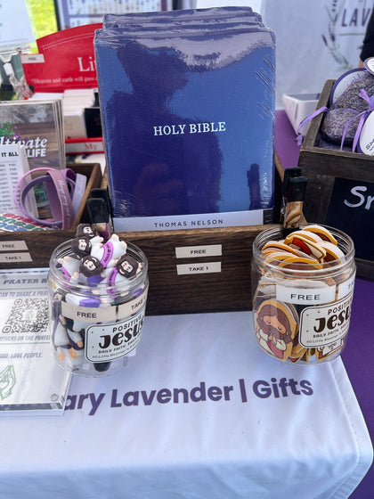 Free Bibles and small Positive Jesus gifts on a market table