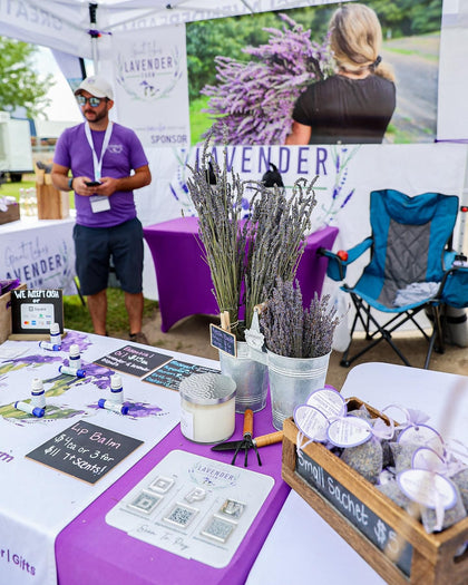 Market table with lavender bundles, candles, oils and sachets